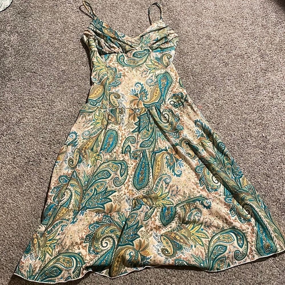 I’m selling a fairy-like midi dress with blue/green paisley and spaghetti straps